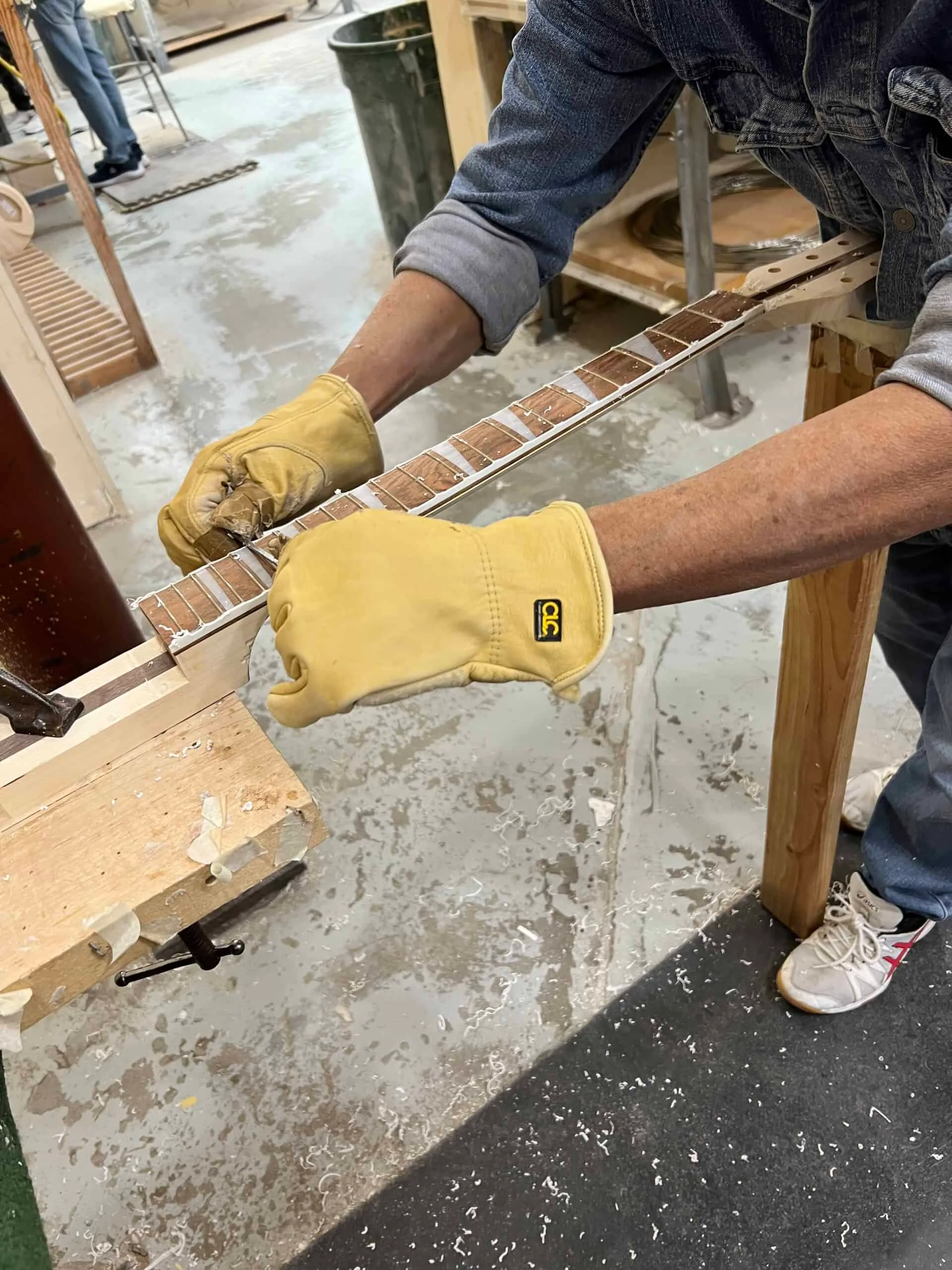 Guitar neck binding trimmed to fingerboard