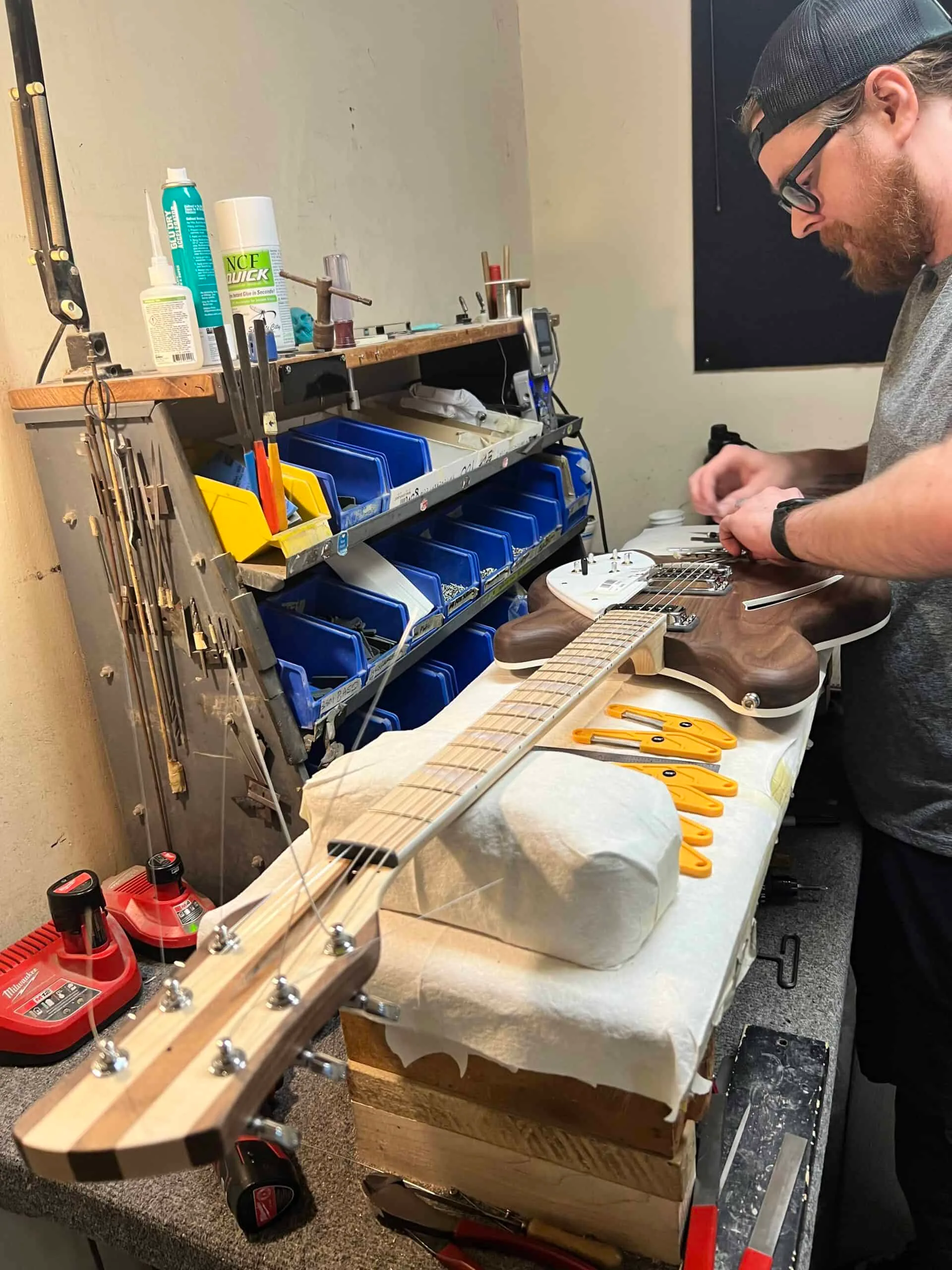 Guitar stringing during final assembly
